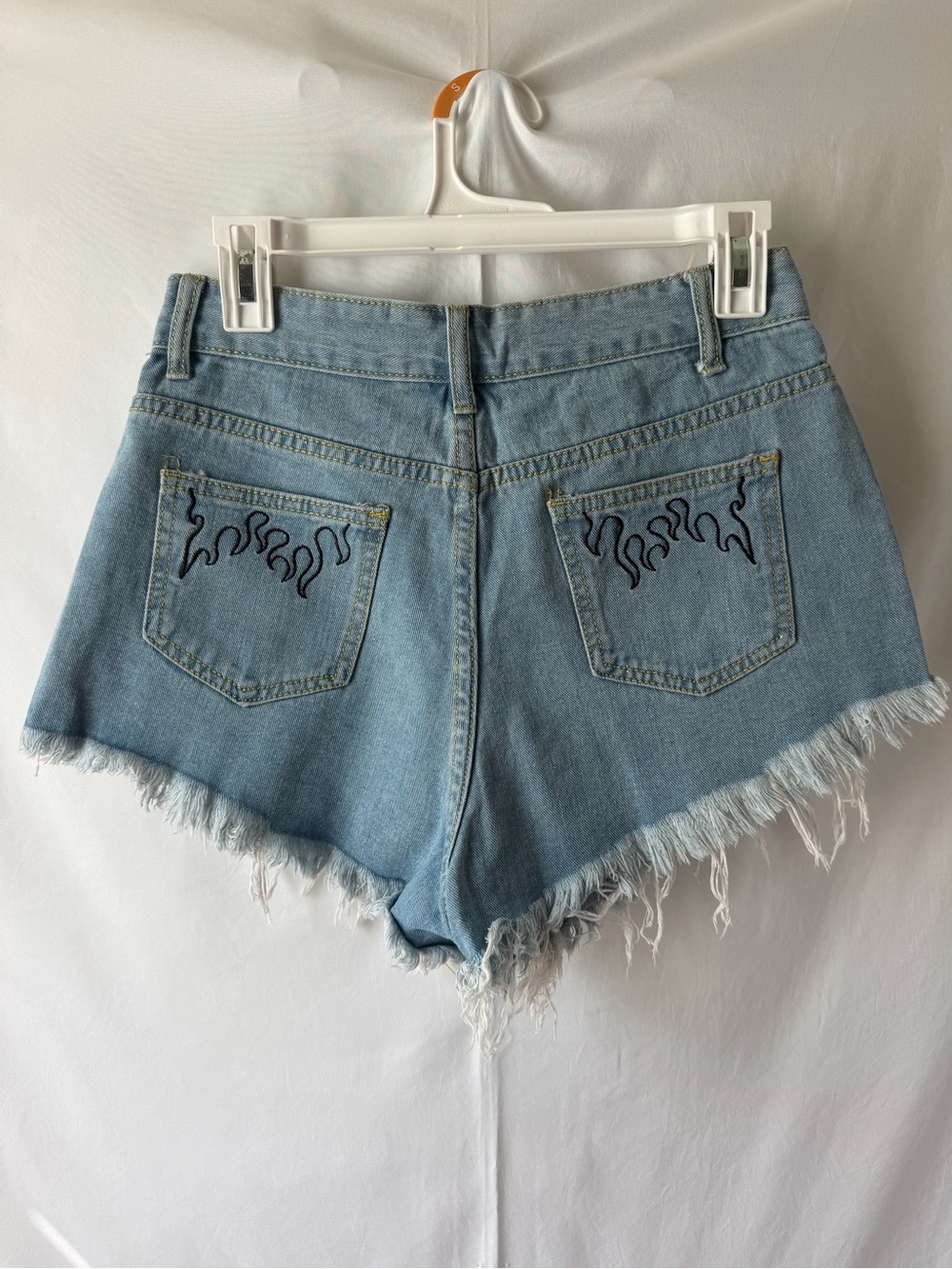 SHEIN light denim shorts with flame detail